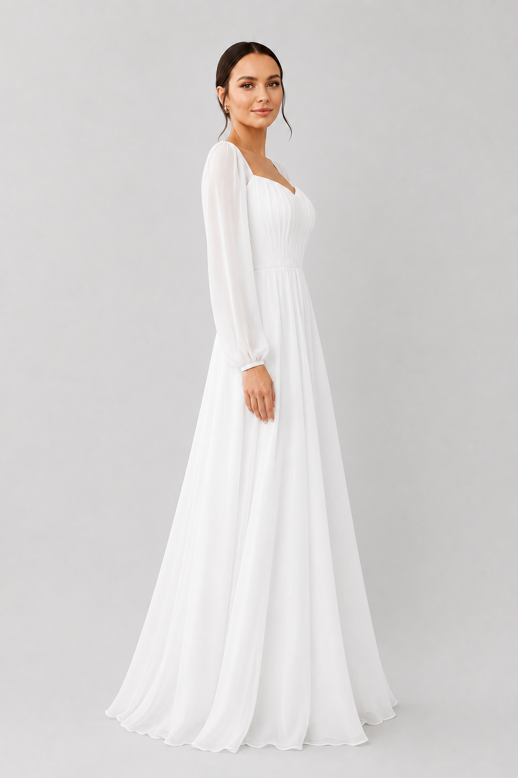 White special occasion maxi dress with sweetheart neckline & long sleeves, an elegant choice for evening wear.