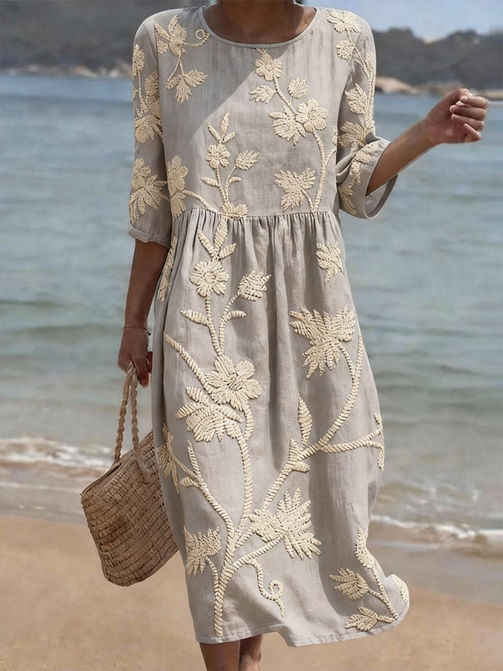 Beautiful summer day dress: women's embroidered midi with three-quarter sleeves & comfortable, effortless style.