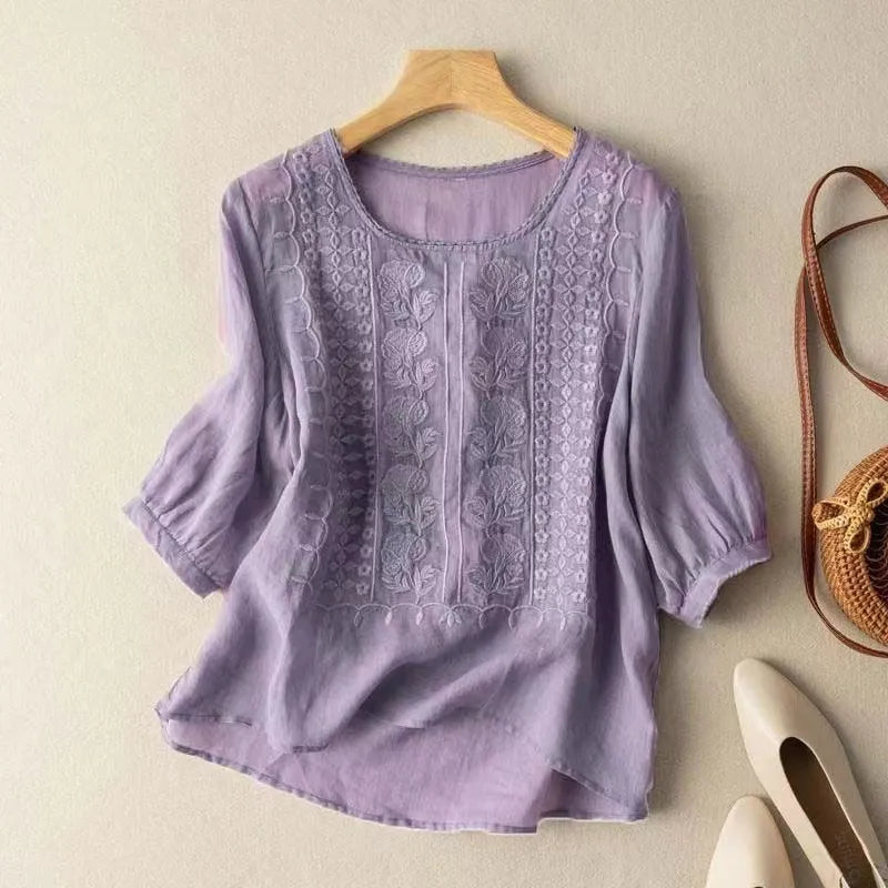 Versatile women's embroidered top with puff sleeves & floral design, ideal for casual or elegant looks.