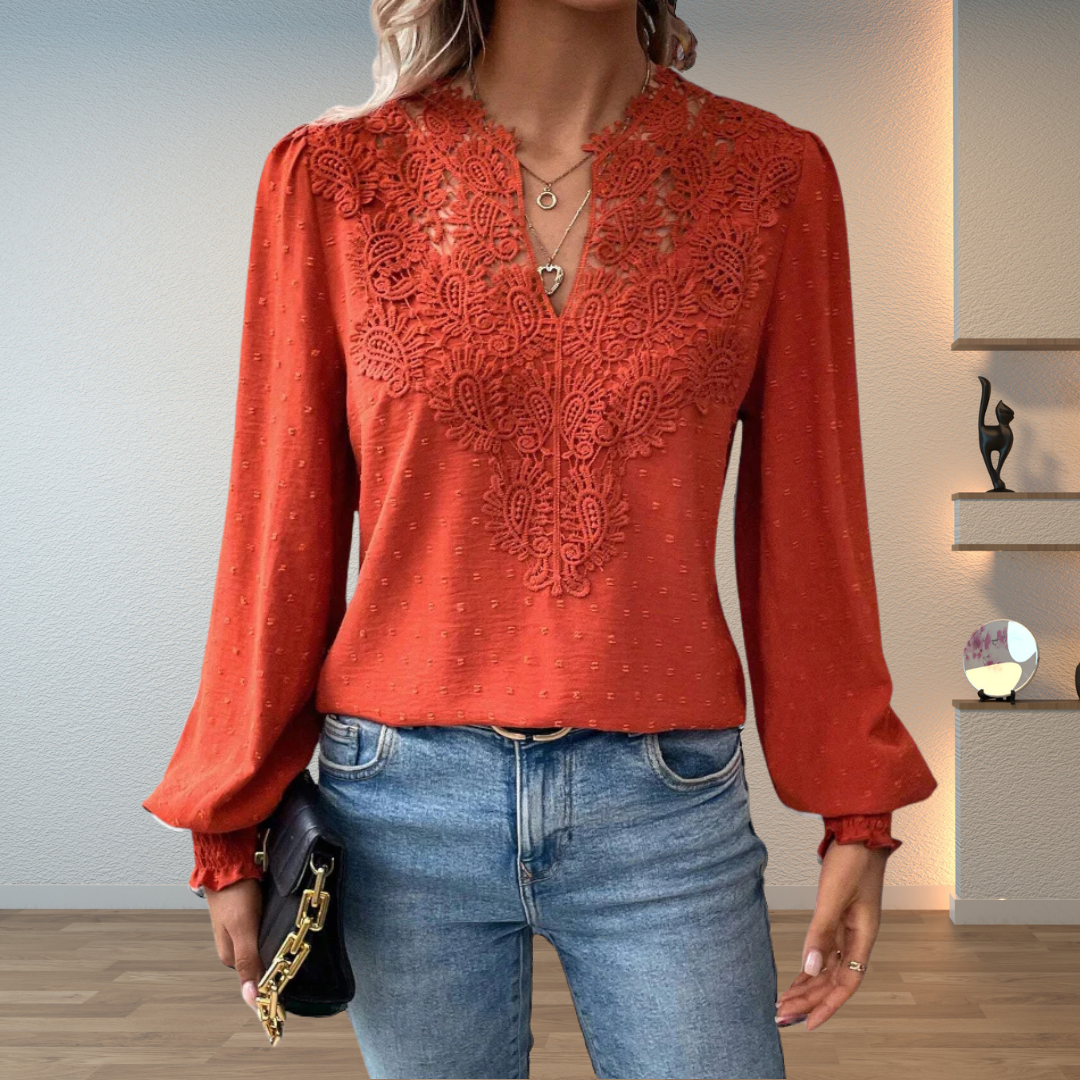 Women's embroidered V-neck long sleeve blouse with puff sleeves, perfect for chic spring fashion.