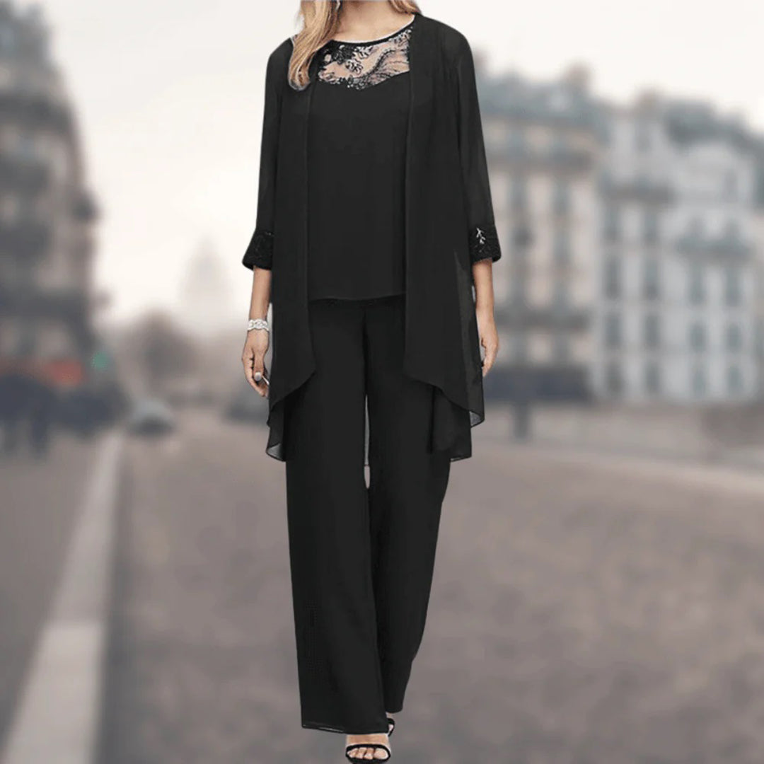 Women's floaty three-piece lounge set with elegant wide-leg pants, comfortable jacket, and delicate lace trim.
