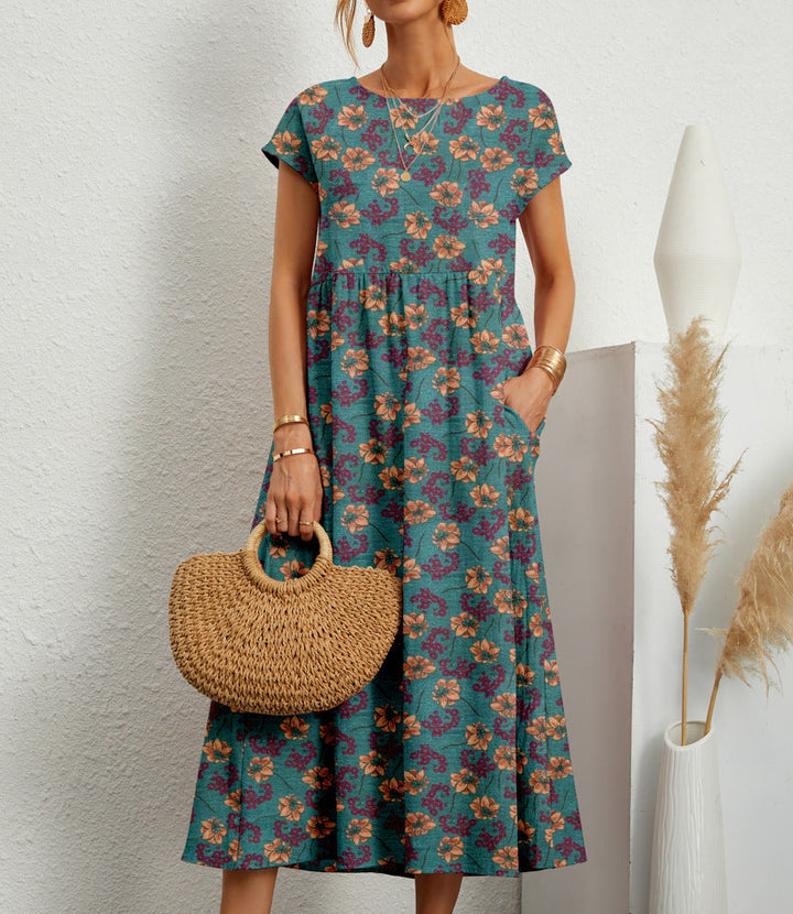 Stylish women's floral A-line dress with short sleeves. Comfortable midi length, ideal for casual days & summer events.