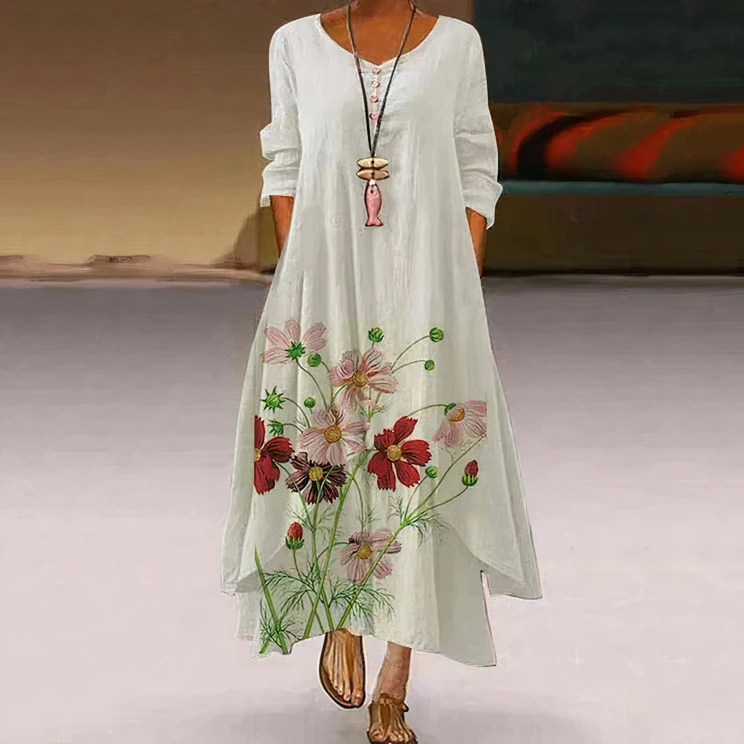 Women's floral border print maxi dress with long sleeves. Perfect for casual spring/summer elegance.