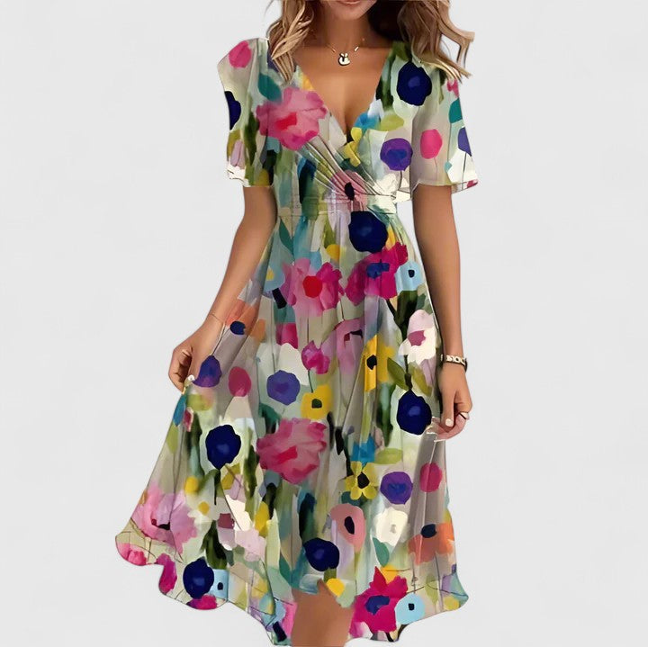 Flowy women's floral midi dress, featuring flutter sleeves, V-neck, and stylish high-low hem, ideal for casual or party wear.