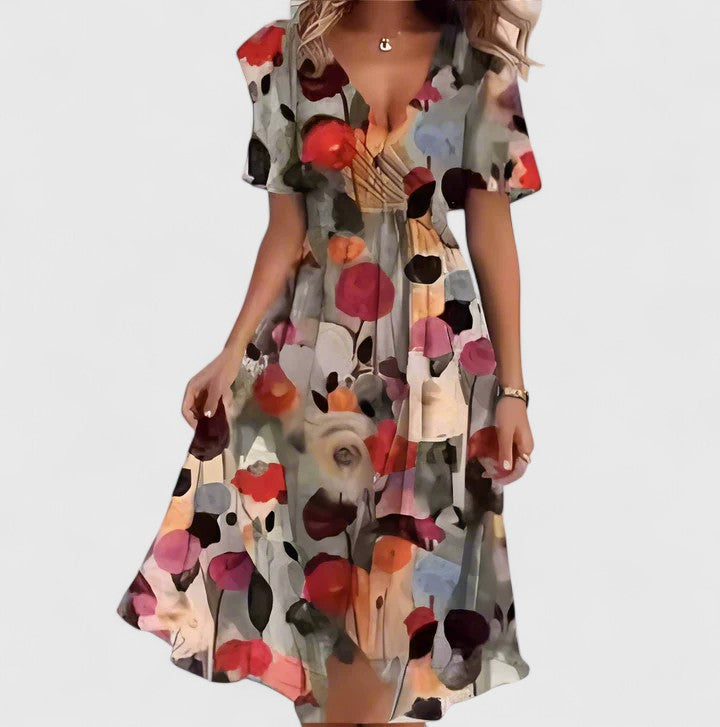 Elegant women's floral V-neck midi dress featuring chic flutter sleeves and a flattering high-low hem for any occasion.