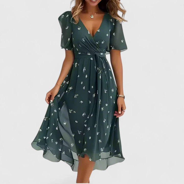 Stylish women's midi dress showcasing a beautiful floral pattern, flutter sleeves, V-neck, and a distinctive high-low hem.