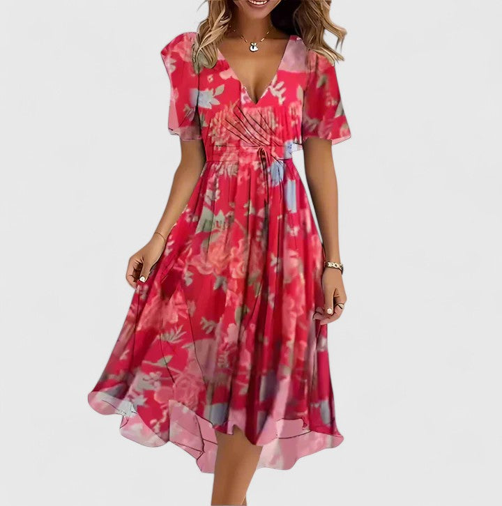 Chic women's floral midi dress with delicate flutter sleeves, V-neck, and an elegant high-low hem, perfect for warm weather.