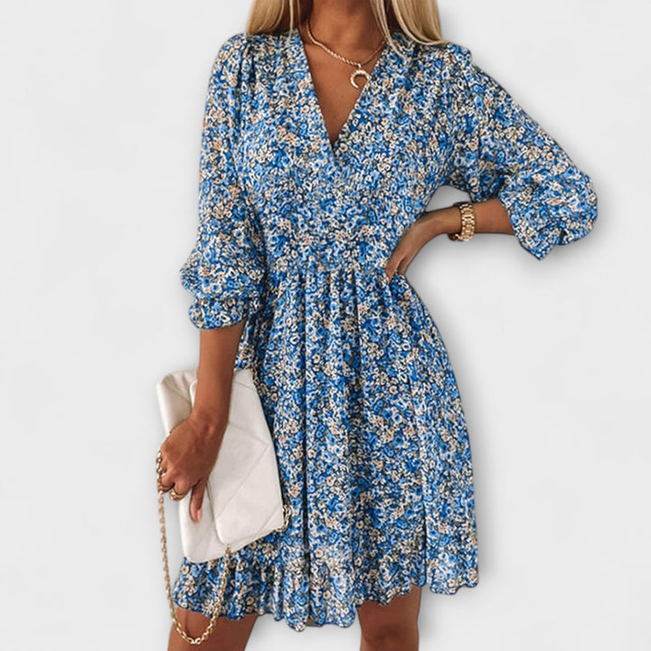 Stylish women's floral print midi dress featuring puff sleeves and a flattering A-line silhouette.