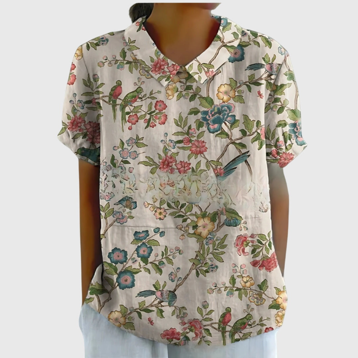 Elegant women's floral print short-sleeve blouse with a classic collar and breathable fabric for warm days.
