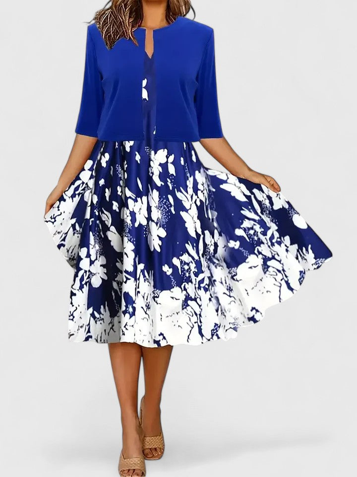 Women's three-quarter sleeve floral print colorblock midi dress with a chic notch neck design. Great for events.