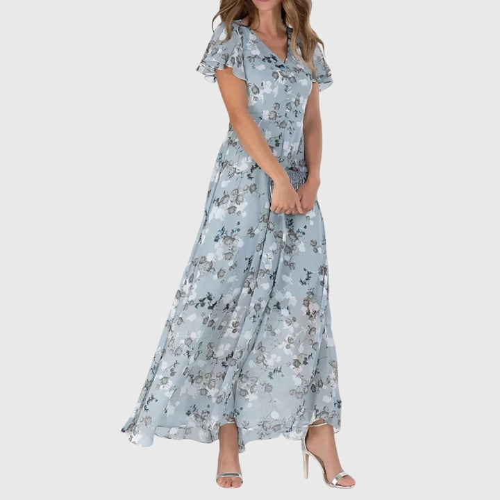 Comfortable women's floral print maxi dress with flutter sleeves, ideal for casual summer or evening wear.