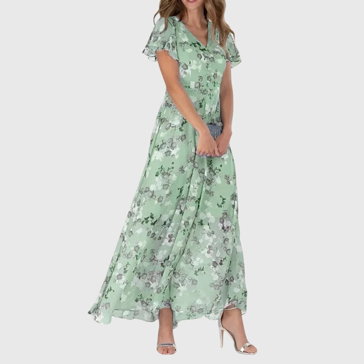 Elegant women's floral print maxi dress, featuring delicate flutter sleeves and a flattering v-neck design.