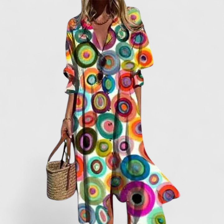 Stylish women's button-down floral print midi shirtdress, featuring pintuck pleats and a sophisticated collar.
