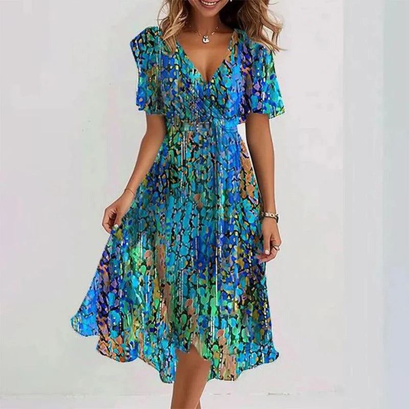 Women's elegant floral wrap V-neck midi dress with flutter sleeves & ruffle hem. Versatile summer party wear.