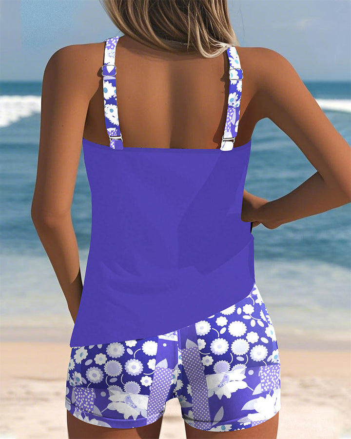 Enjoy your beach vacation in this vibrant floral tankini swimsuit with comfy swim shorts. Women's swimwear.