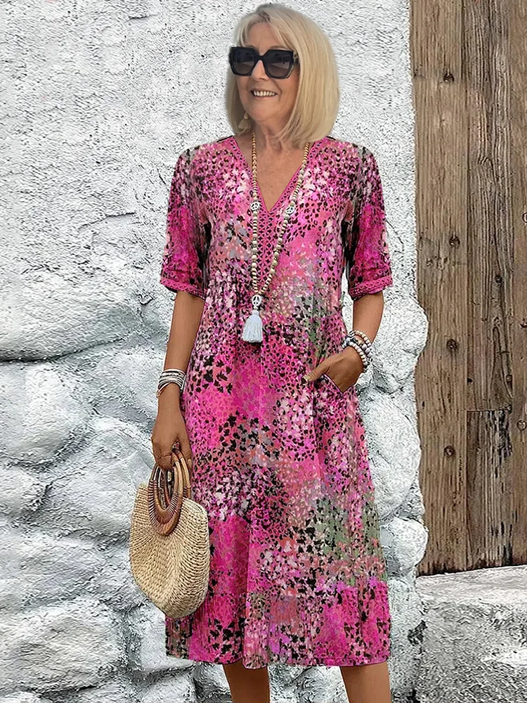 Flowy women's floral midi dress with a flattering V-neck, perfect for comfortable everyday style.