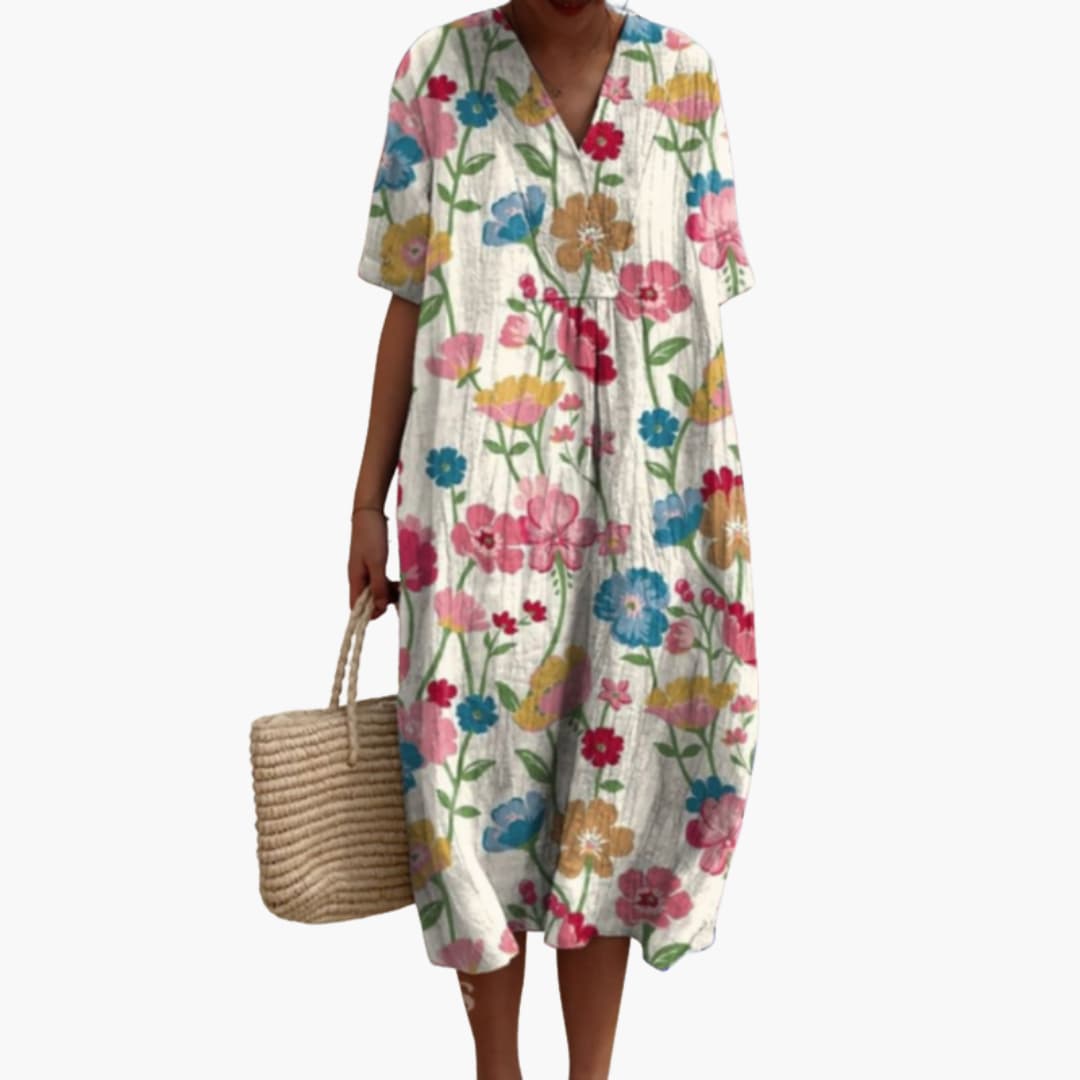 Women's floral V-neck oversized midi dress with practical pockets, perfect for casual wear.
