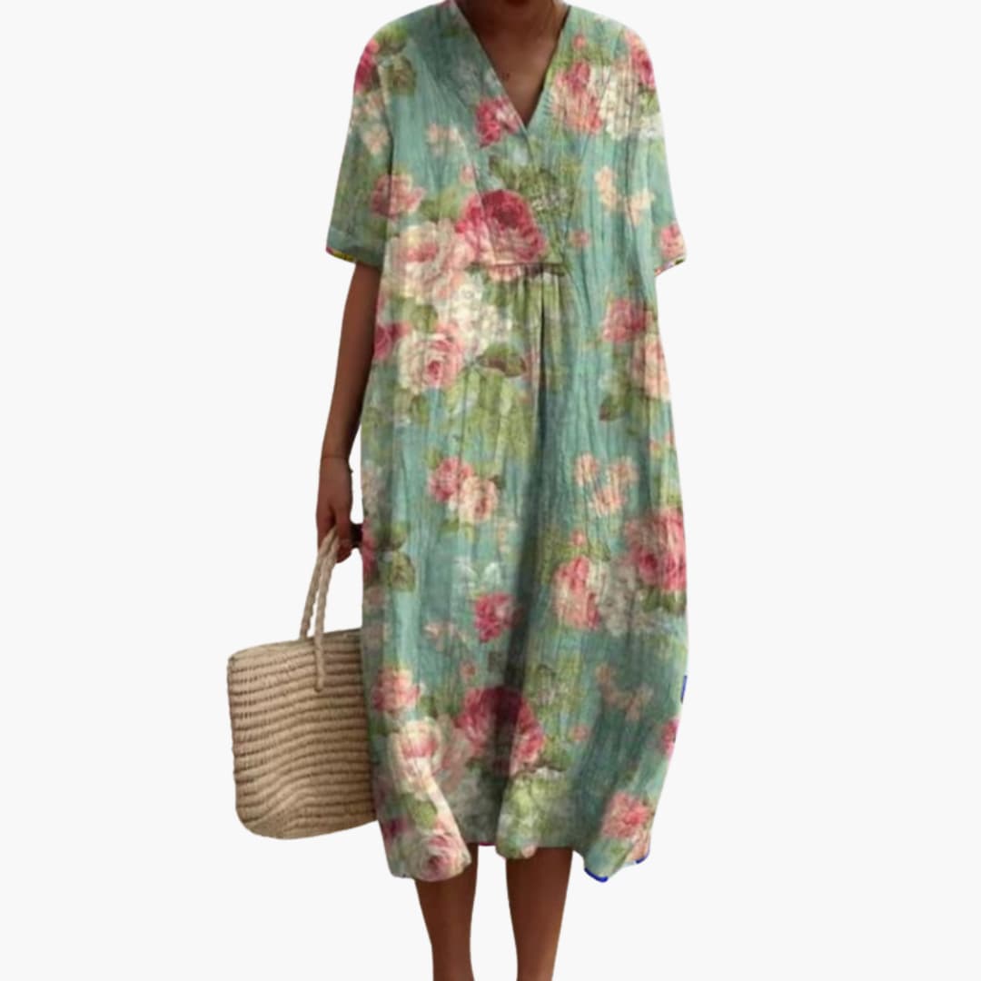 Close-up of the functional pockets on a women's floral V-neck oversized midi dress.