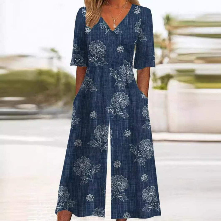Women's floral wide-leg jumpsuit with V-neck & elbow sleeves. Bohemian palazzo style, perfect for summer casual wear.