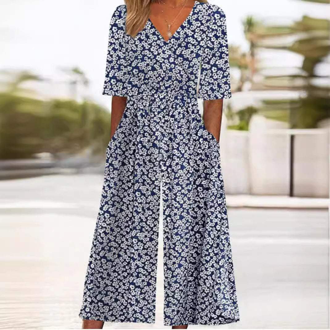 Stylish floral wide-leg V-neck jumpsuit for women. Elbow sleeve palazzo, perfect for bohemian summer fashion & events.