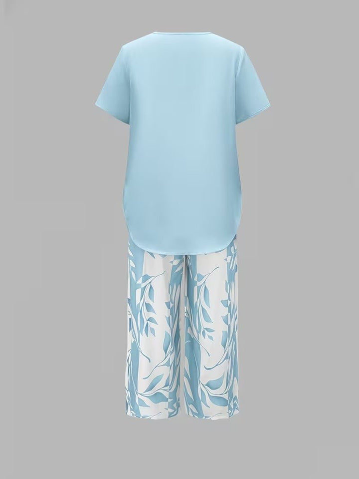 Boho-chic women's floral print wide-leg pant set with a relaxed V-neck short sleeve top.
