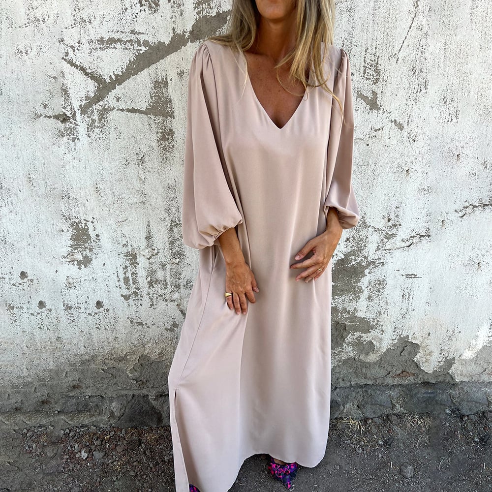 Versatile women's V-neck maxi dress with billowy balloon sleeves and a flowy silhouette, ideal for resort wear.