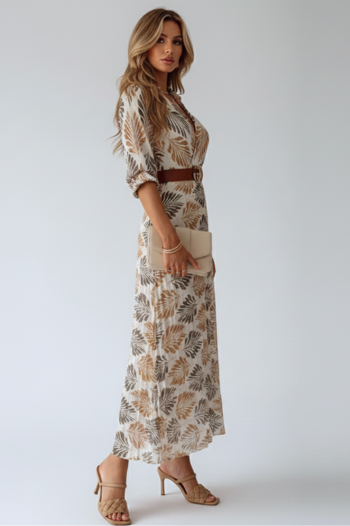 Flowy long maxi dress for women featuring a beautiful floral pattern and flattering elbow sleeves. Great for casual wear.