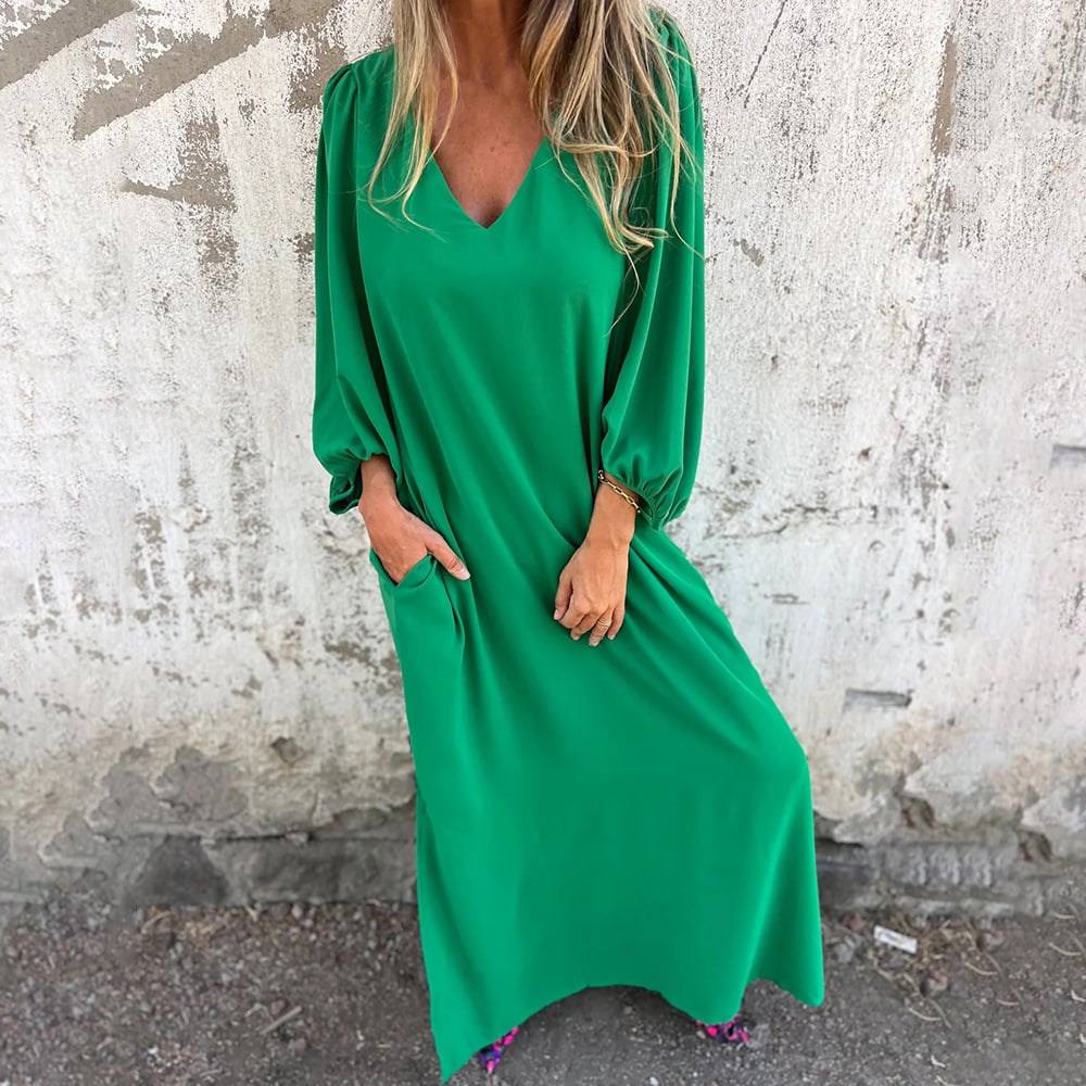 Lightweight women's summer maxi dress featuring a comfortable flowy fit, V-neck, and roomy pockets.