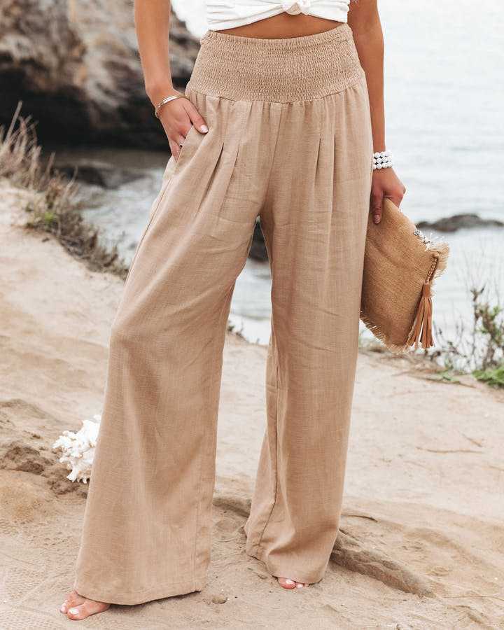 Women's flowy wide leg beach trousers, perfect for summer comfort & resort wear. Stylish elastic waist pants.