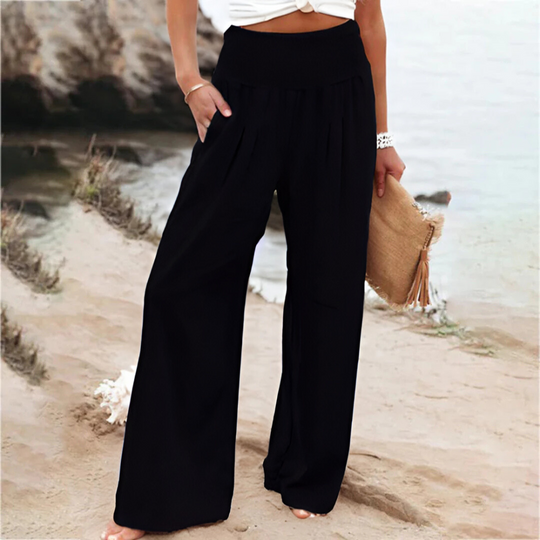 Women's flowy wide leg summer pants, comfortable elastic waist, perfect for warm weather.