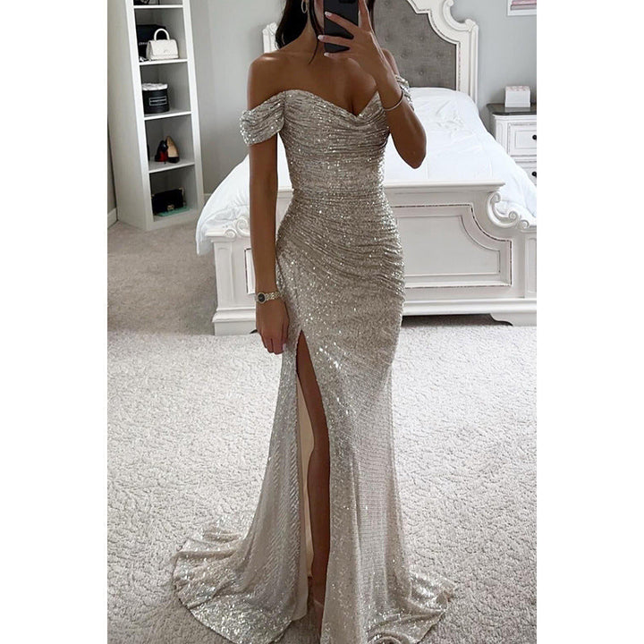 Side view of women's sequin off-shoulder prom dress. Glamorous high slit, bodycon maxi, stunning for formal wear.