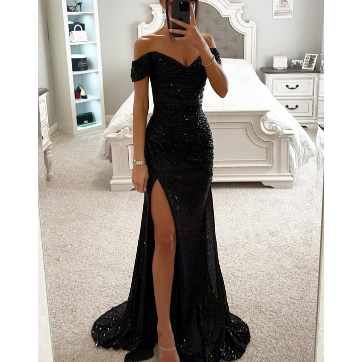 Full length: Women's sparkling sequin off-shoulder maxi gown. High slit, bodycon fit, ideal for wedding guests.