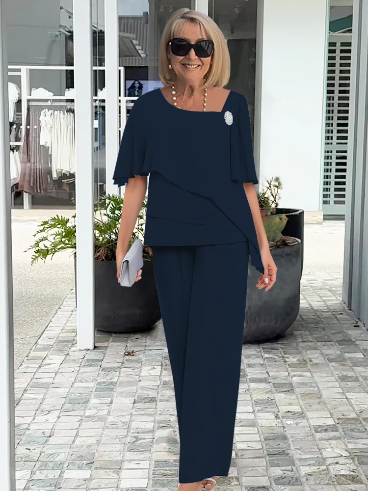 Matching women's overlay top & full-length straight-leg pants set. Versatile & comfortable two-piece outfit.
