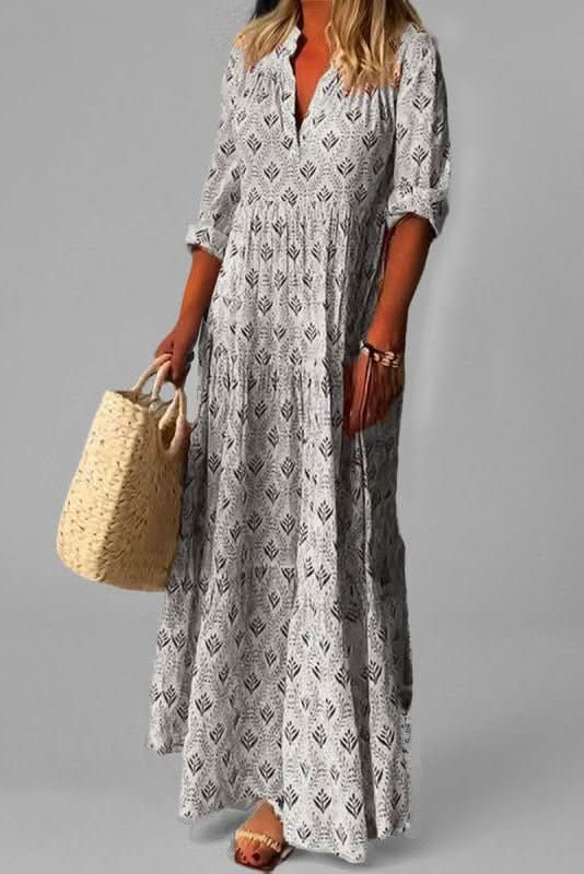Detailed view of the elegant tiers on a women's maxi dress. Soft, flowy fabric creating a graceful, long silhouette.