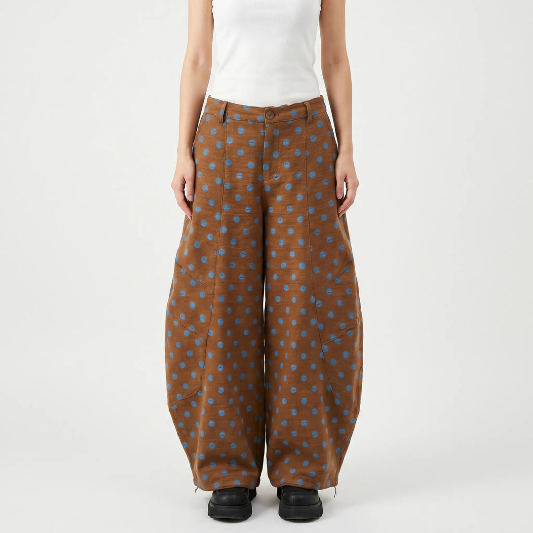 Comfortable women's brown polka dot wide-leg pants, featuring a relaxed barrel-leg fit for casual outings.