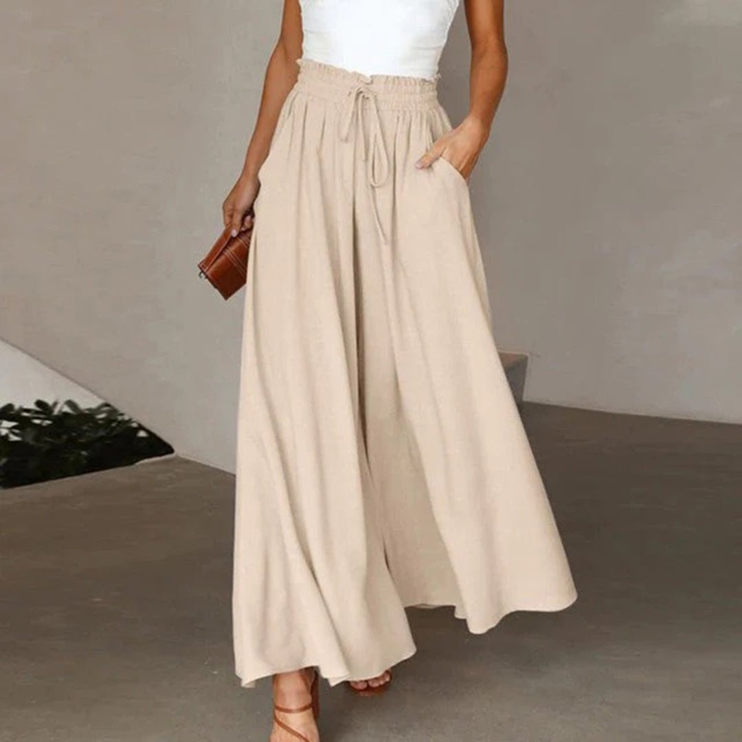 Lightweight women's high waist wide leg pants for summer. Breathable fabric, drawstring waist, and pockets for ease.