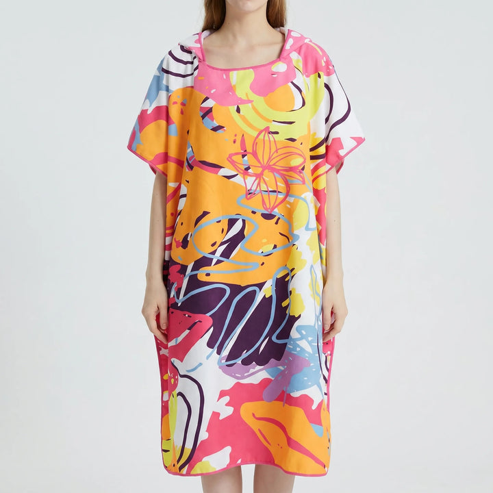 Quick-dry women's hooded beach poncho for pool or travel. Soft, absorbent swim cover-up and changing robe.