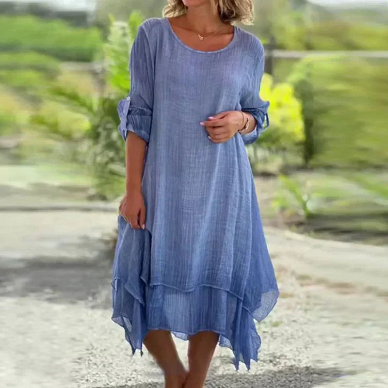 Flowy women's summer midi dress, layered design with 3/4 sleeves, ideal for vacation or casual wear.