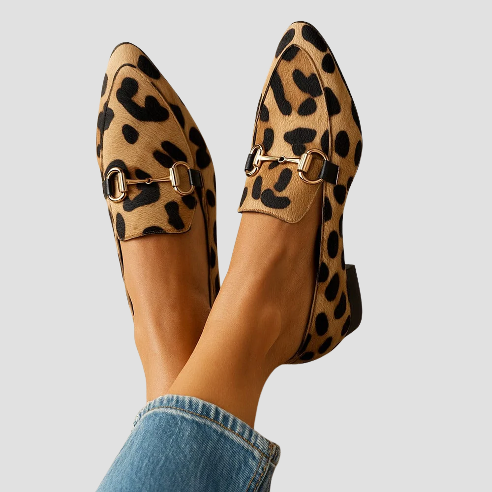 Women's leopard print pointed-toe horsebit loafers. Elegant slip-on flats with chic animal print for fashion.