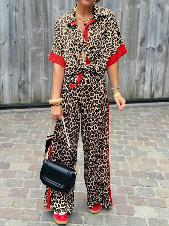 Women's leopard print wide leg jumpsuit with v-neck. Stylish, relaxed fit for summer fashion.