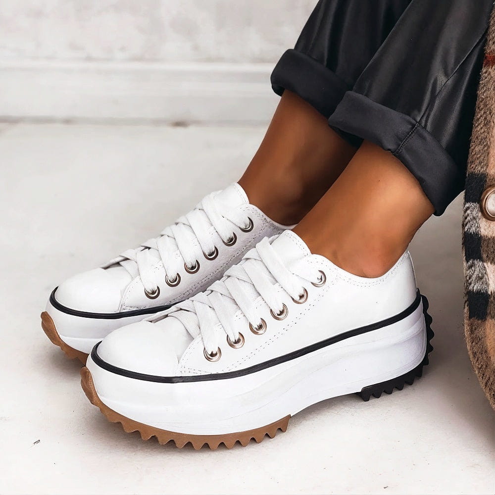 Front view of women's comfortable sneakers, featuring breathable mesh and sleek design for fashion & function.