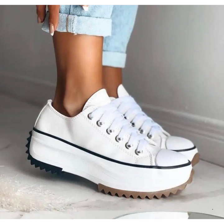 Side profile of a women's lightweight sneaker, highlighting its cushioned sole and breathable upper.