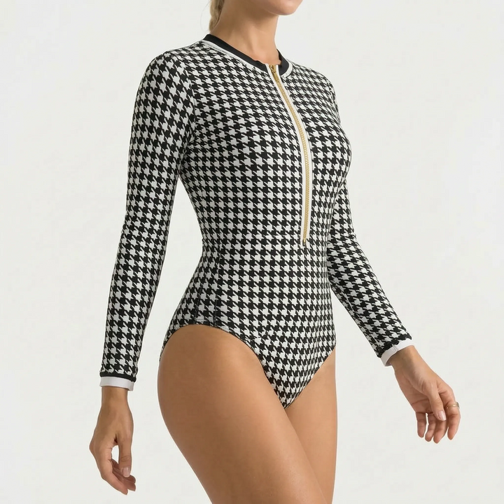 Comfortable long-sleeve women's one-piece swimsuit, zipper front, for active beachwear & surf.