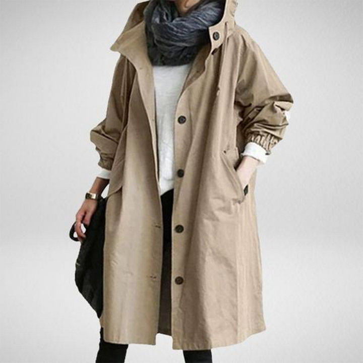 Women's long water-resistant raincoat, a stylish and protective outerwear piece for all-weather functionality.