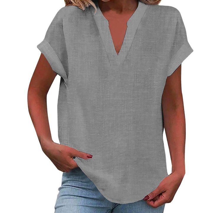 Lightweight women's V-neck blouse, loose fit & short sleeve for cool summer fashion and ultimate comfort.