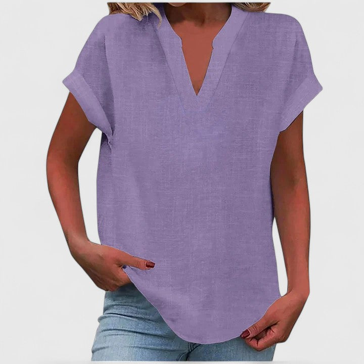 Chic women's loose fit V-neck blouse, cap sleeve design, curved hem for a stylish casual top.