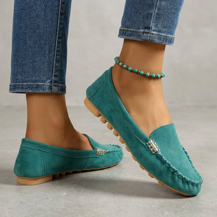 Women's driving moccasin loafers, designed for comfort & style with orthopedic features and metallic detailing.