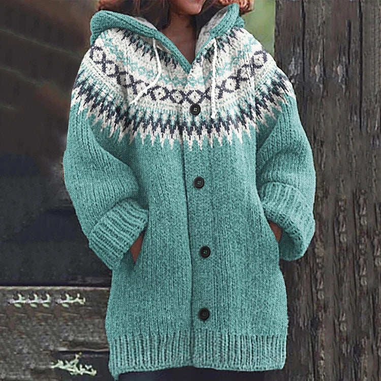 Woman wearing a warm, long sleeve Nordic hooded knit cardigan, showcasing its comfortable relaxed fit.