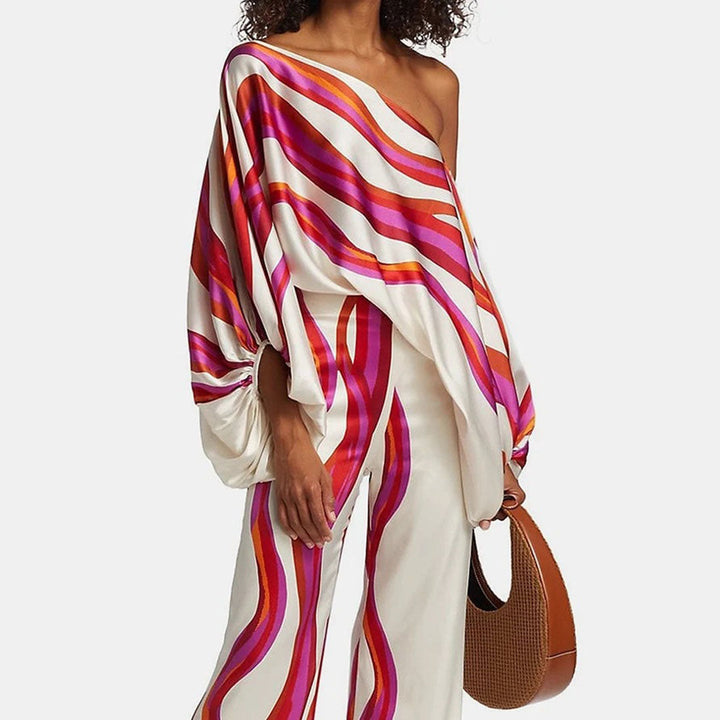 Trendy women's off-shoulder printed two-piece set with a stylish pattern for summer fashion.
