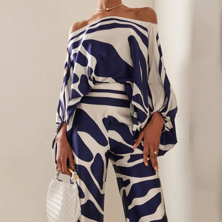 Vacation-ready women's off-shoulder printed two-piece set, perfect for stylish summer beach wear.